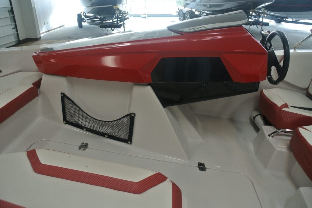 Close-up view of racing boat interior with sleek red and white design, perfect for speed enthusiasts and boating supply seekers.
