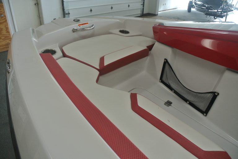 High-quality speedboat interior with red and white cushions for water sports and marine activities.