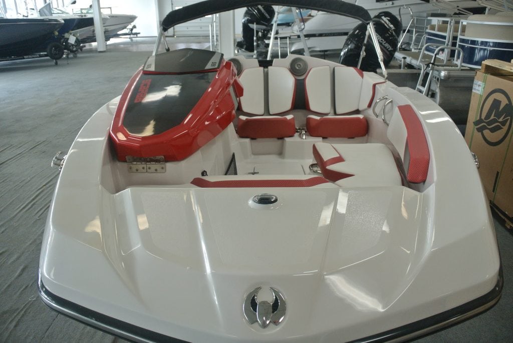 Modern red and white speedboat with comfortable seating and Yamaha engine.