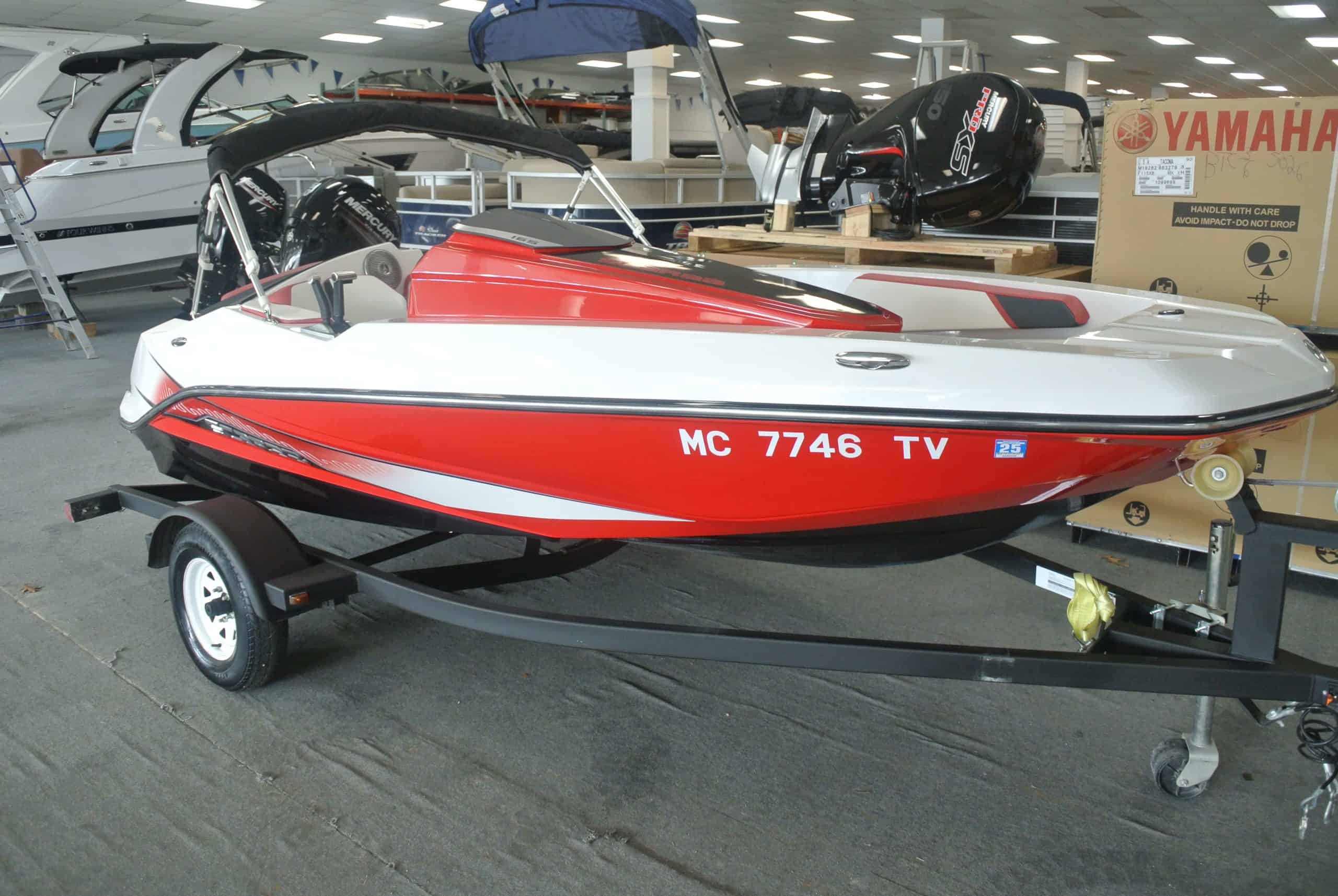 Boat with Yamaha outboard motor, ideal for water sports and boating adventures.