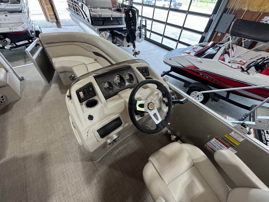 Bennington 20 SXSR pontoon boat dashboard with steering wheel and gauges at Hall's Sport Center.