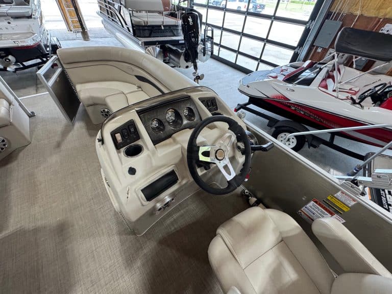 Bennington 20 SXSR pontoon boat dashboard with steering wheel and gauges at Hall's Sport Center.