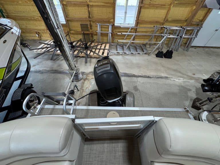 Bennington 20 SXSR pontoon boat in showroom, perfect for water fun.