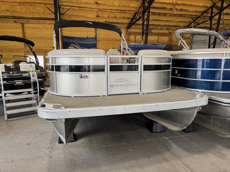 Pontoon boat for sale at Hall's Sport Center, ideal for family outings and water adventures.