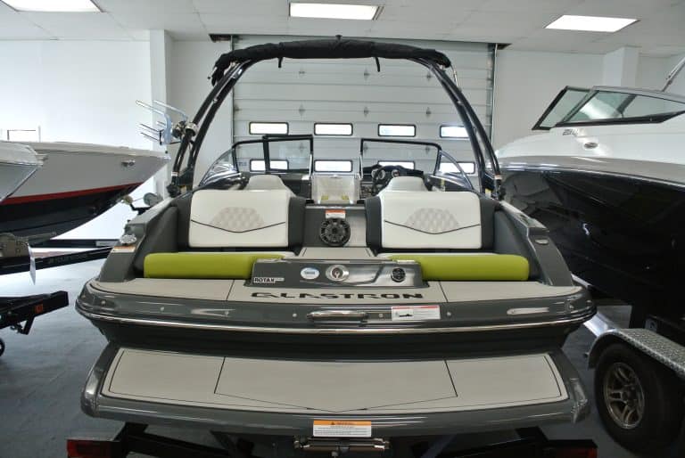 Bright indoor boat display showcasing luxury watercraft and marine accessories at Hall's Sport Center.