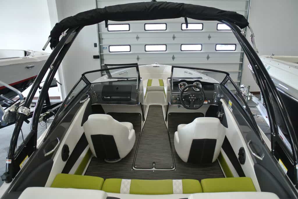 Bright, spacious boat showroom featuring sleek watercraft at Hall's Sport Center.