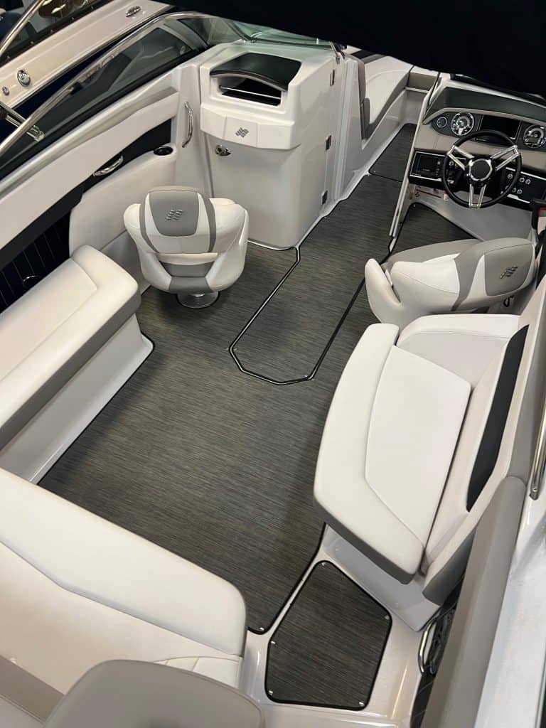 Elegant boat cockpit with white seating and modern controls.