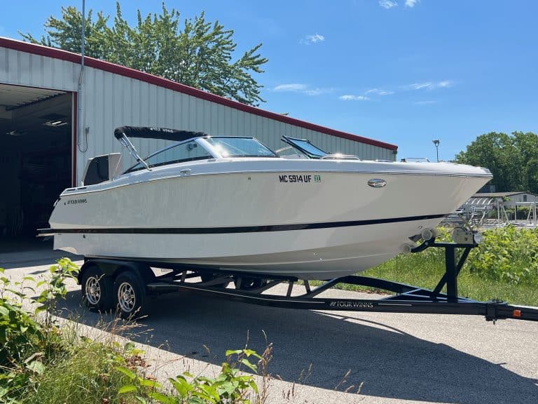 Four Winns H260 luxury boat on trailer at Hall's Sport Center.