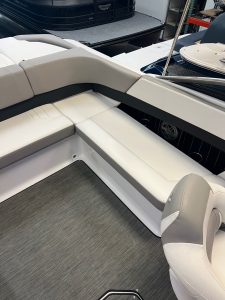 Comfortable boat seating with white upholstery and spacious layout.