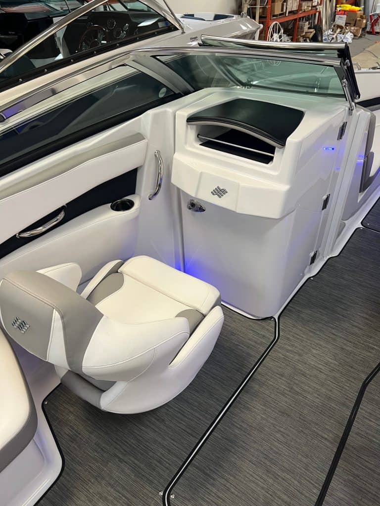 Boat cockpit with modern helm and seating.