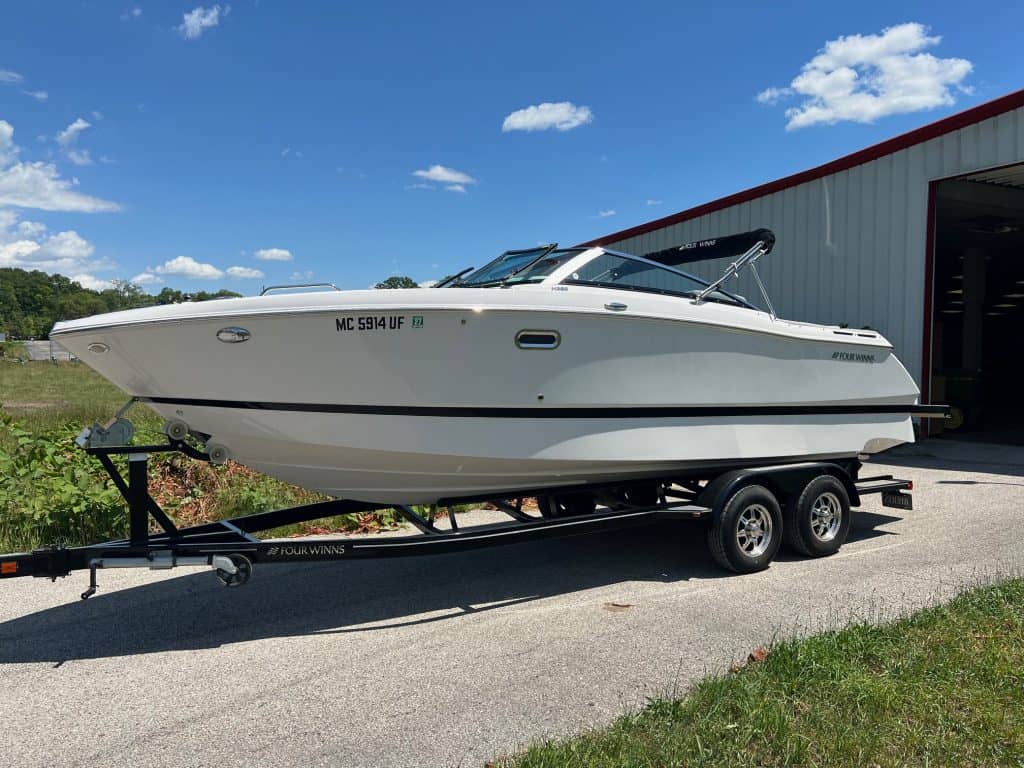 Four Winns H260 boat on trailer at Hall's Sport Center.