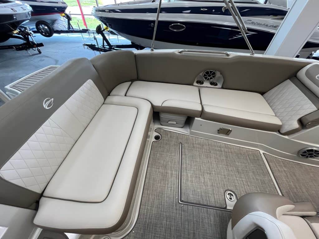 Boat lounge with comfortable seating, high-quality upholstery, and built-in stereo system for outdoor leisure.