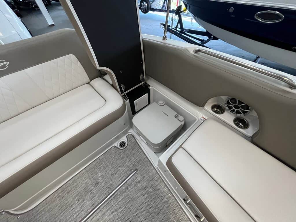 Luxury boat seating with built-in cup holders and radio speakers, perfect for comfort and entertainment.