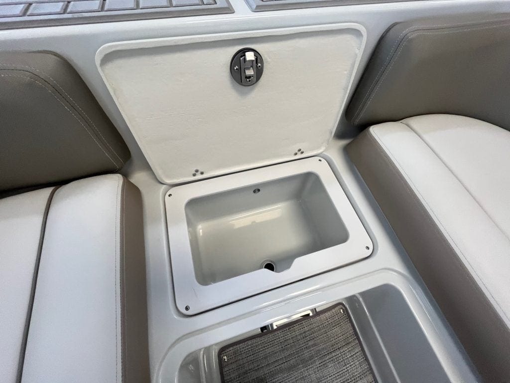 Removable storage compartment in boat seating for sports gear and personal items.