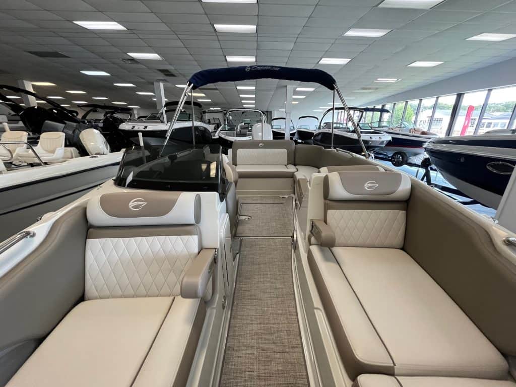 Comfortable pontoon boat interior at Hall's Sport Center, featuring plush seating and modern design.