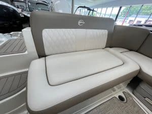 Boat seating with premium white and gray quilted cushions, ideal for comfortable cruising and outdoor leisure on the water.