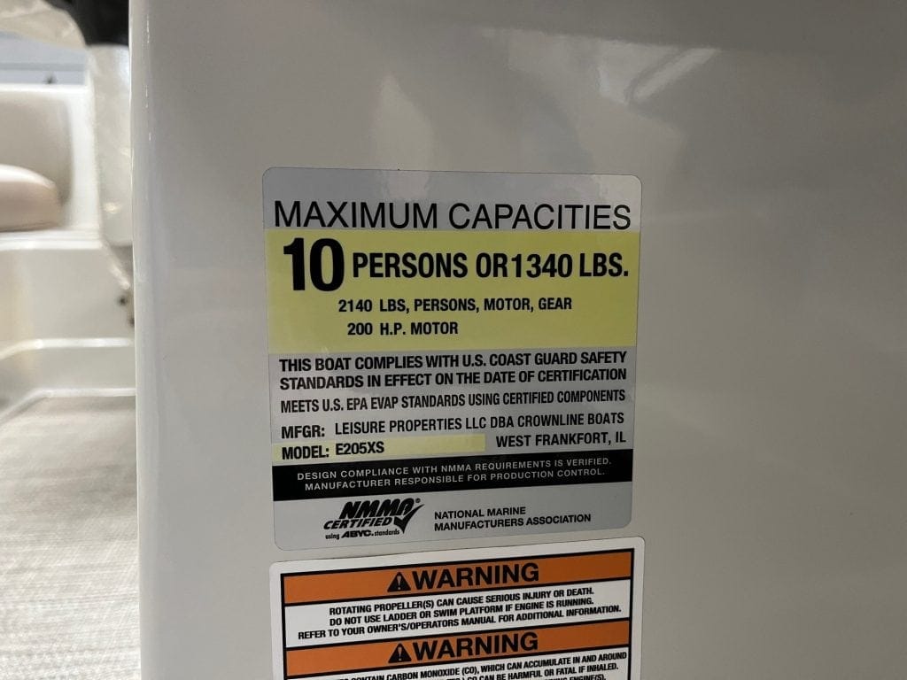 Durable boat capacity label with safety standards.