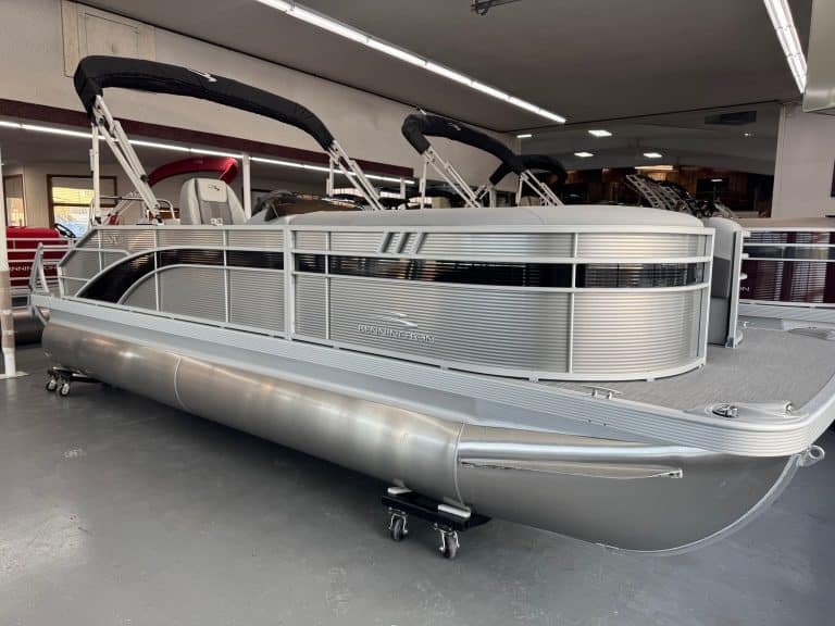 Modern aluminum pontoon boat displayed at Hall's Sport Center for sale.