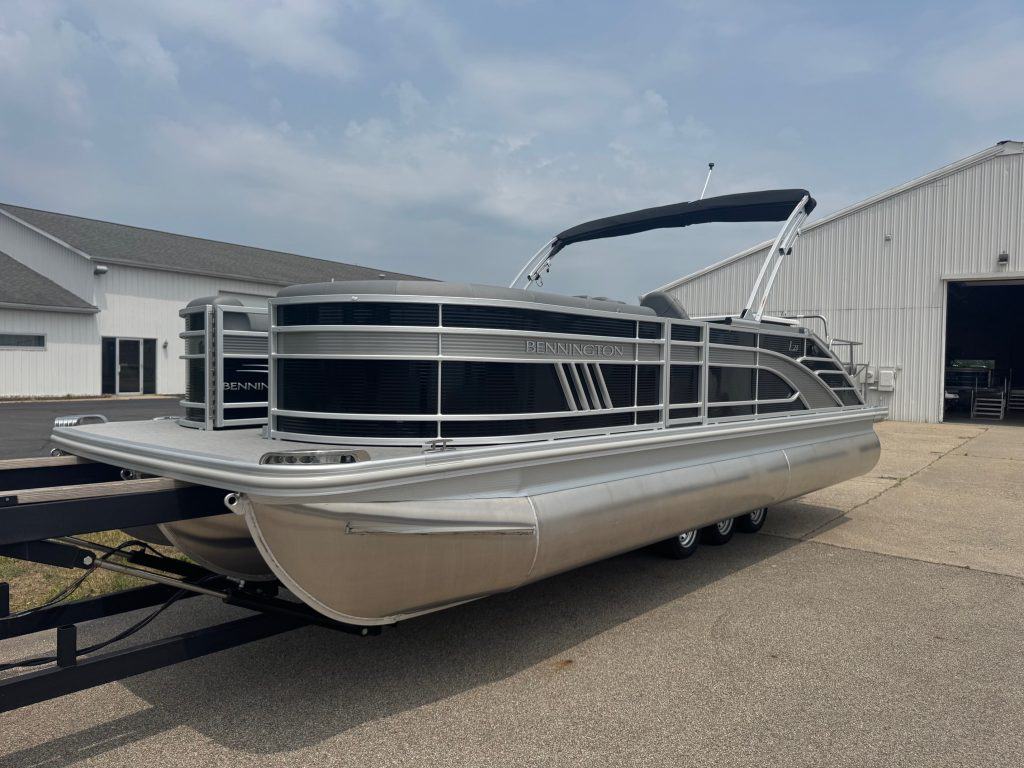Luxury pontoon boat with Bennington branding, ideal for leisure cruises and water fun. Built for comfort and durability.