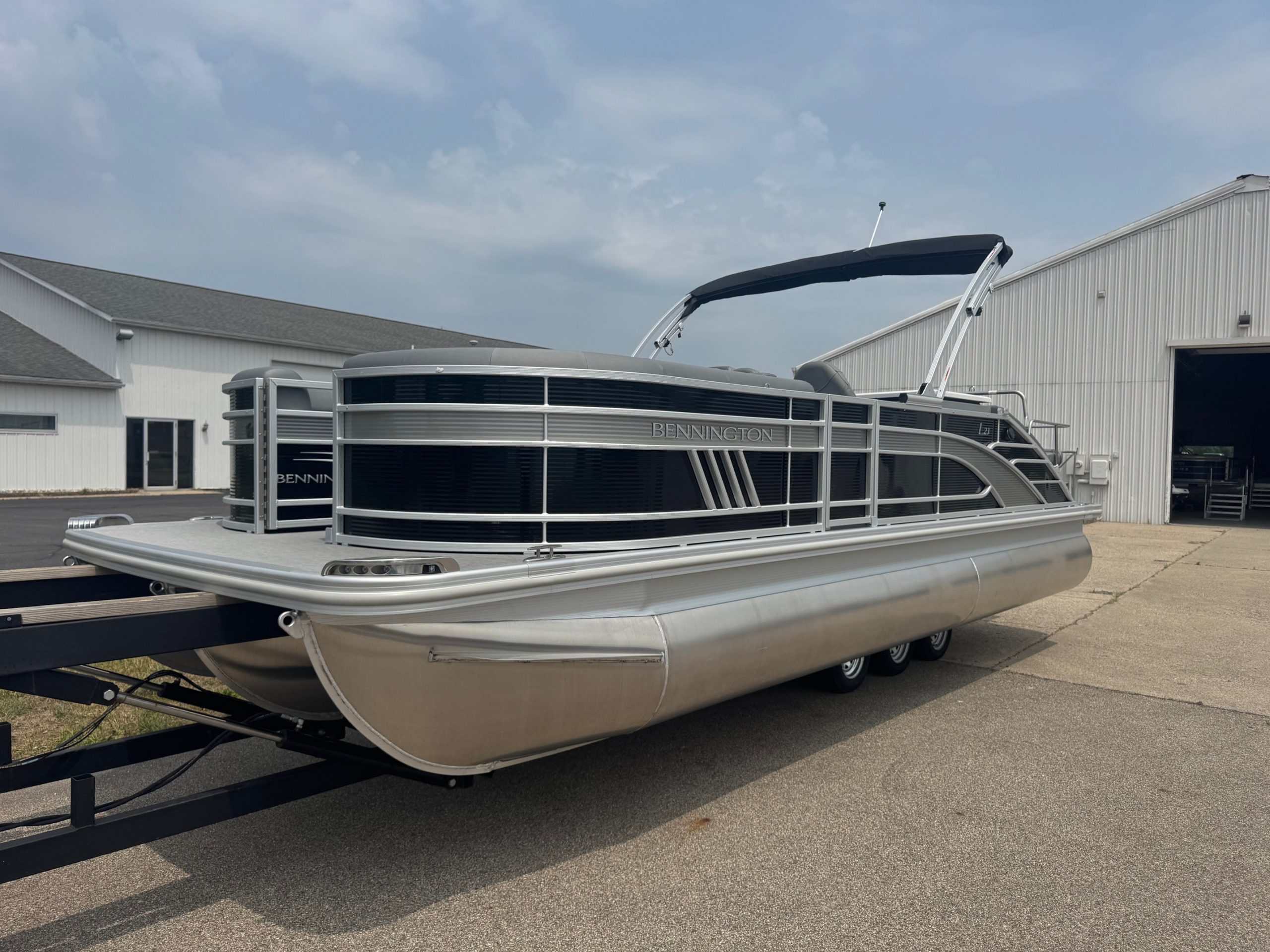 Luxury pontoon boat with Bennington branding, ideal for leisure cruises and water fun. Built for comfort and durability.