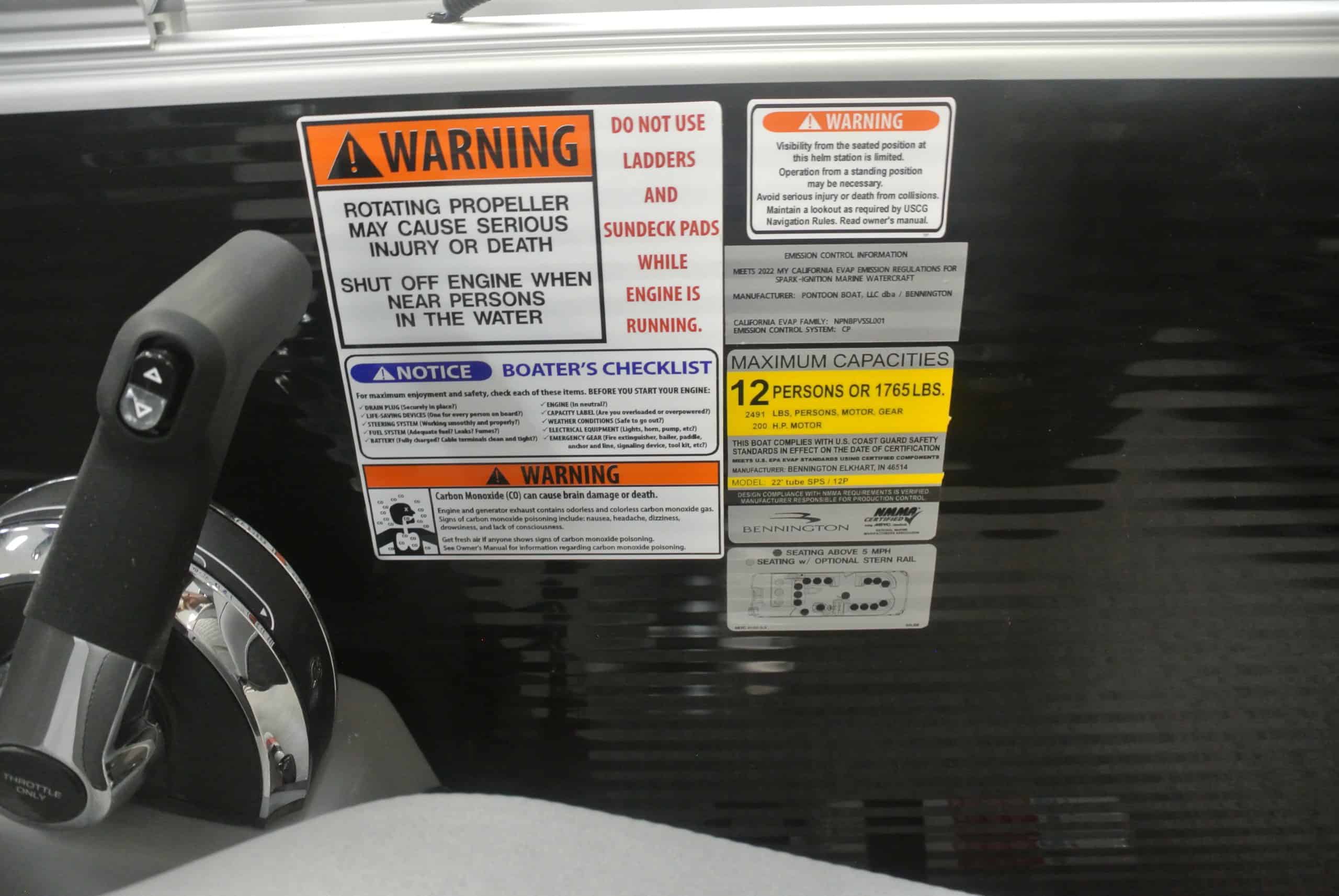 Boat engine warning label with safety instructions, maximum capacity, and emissions info for boating safety.