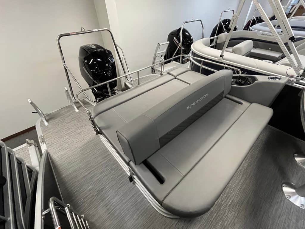 High-quality Bennington boat seating and outboard motors on display.