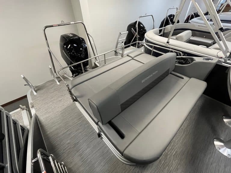 High-quality Bennington boat seating and outboard motors on display.