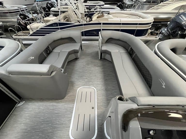 Luxurious marine lounge seating with plush cushions and speakers at Hall's Sport Center, perfect for boating and water adventures.