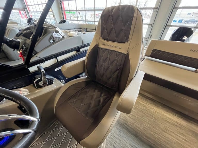 High-quality custom golf cart seat featuring beige and brown quilted leather with diamond stitching, displayed at Hall's Sport Center.