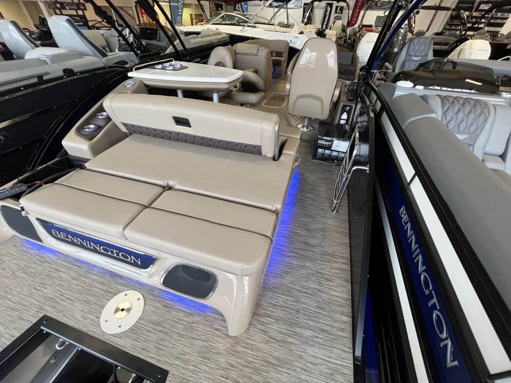 High-quality Bennington pontoon boat with comfortable seating, built for leisure and entertainment at Hall's Sport Center.