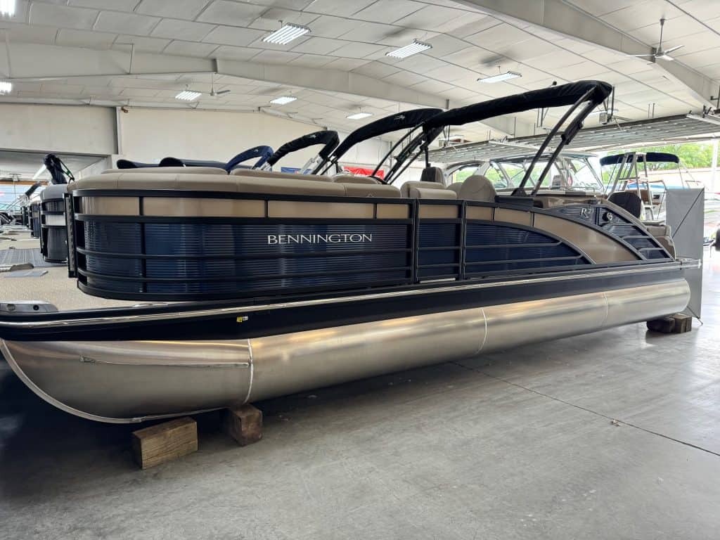 Pontoon boat with spacious deck and comfortable seating.