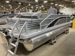 Comfortable aluminum pontoon boat with seating and safety rails. Ideal for lake outings and water adventures.