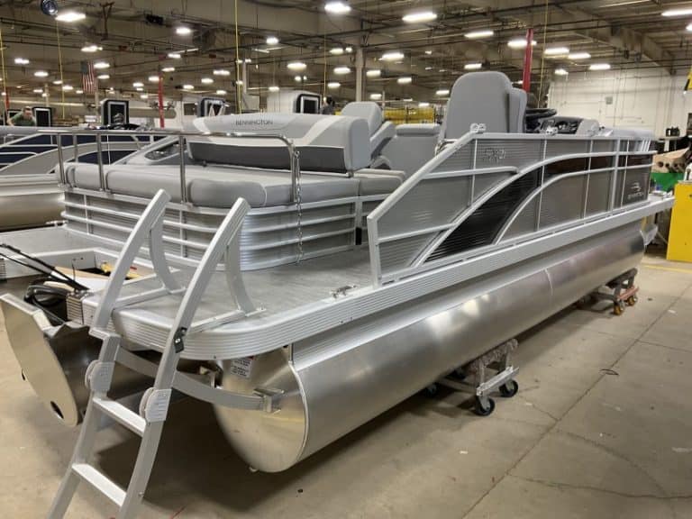 Comfortable aluminum pontoon boat with seating and safety rails. Ideal for lake outings and water adventures.