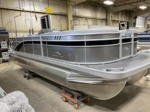 Modern Bennington pontoon boat for water sports and leisure. Perfect for family outings and aquatic adventures.