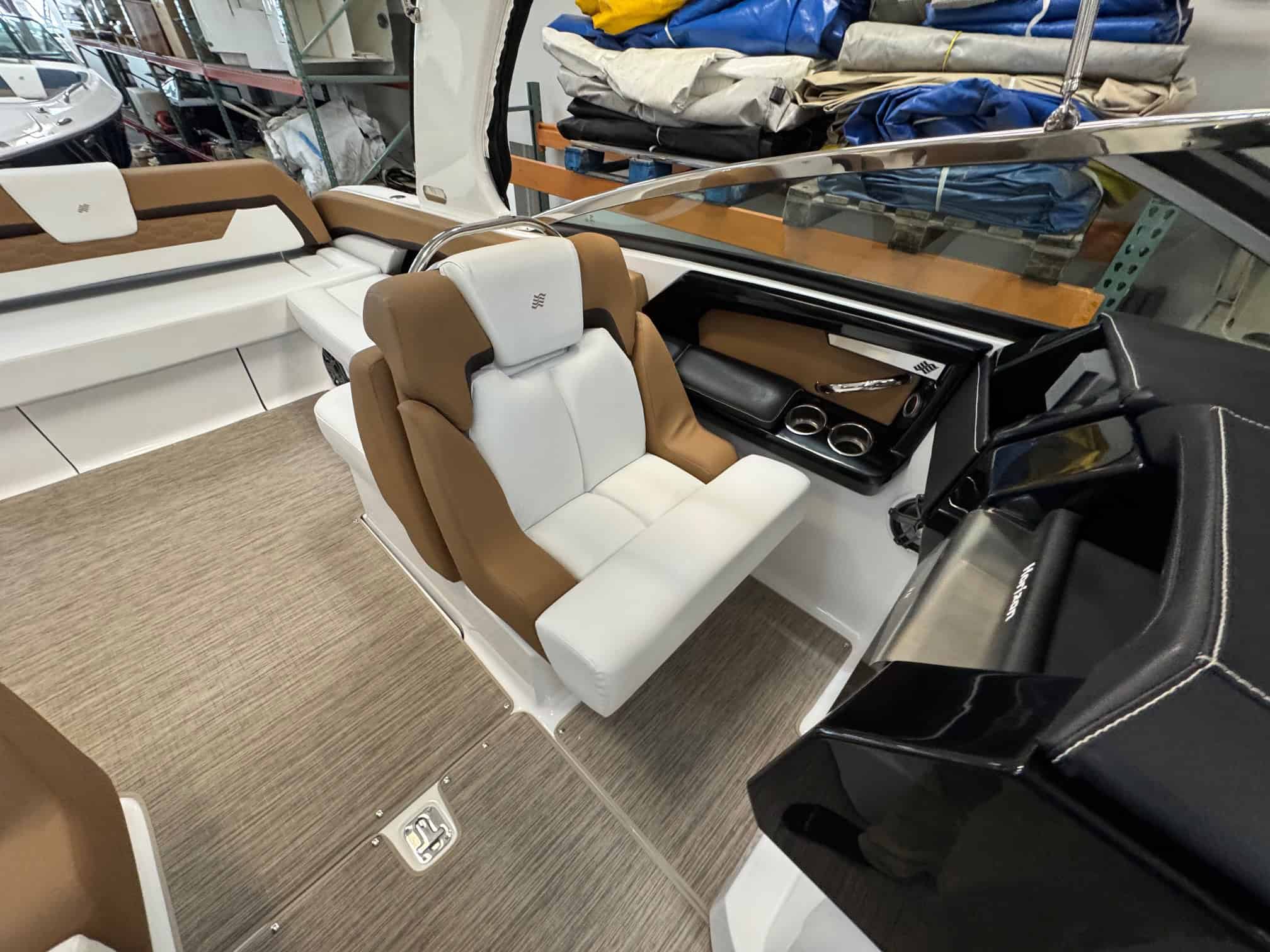 Luxury boat cockpit with comfortable seating and modern controls.