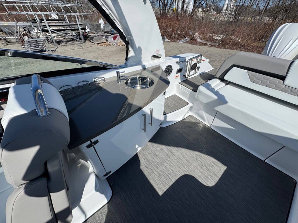 Luxury boat cockpit with modern dashboard and seating.