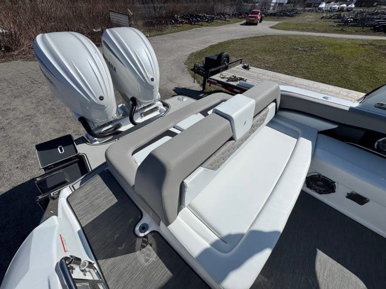 High-performance boat with twin outboard motors and spacious seating.