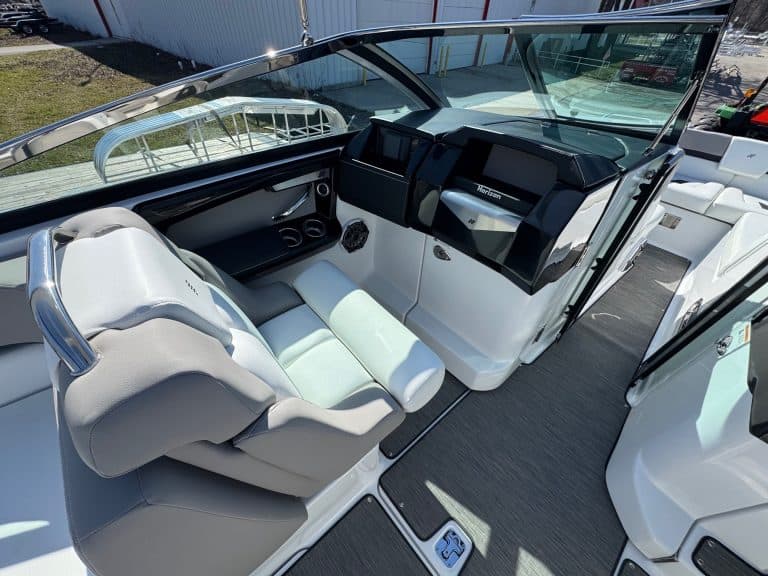 Luxury boat cockpit with modern dashboard and comfortable seating.