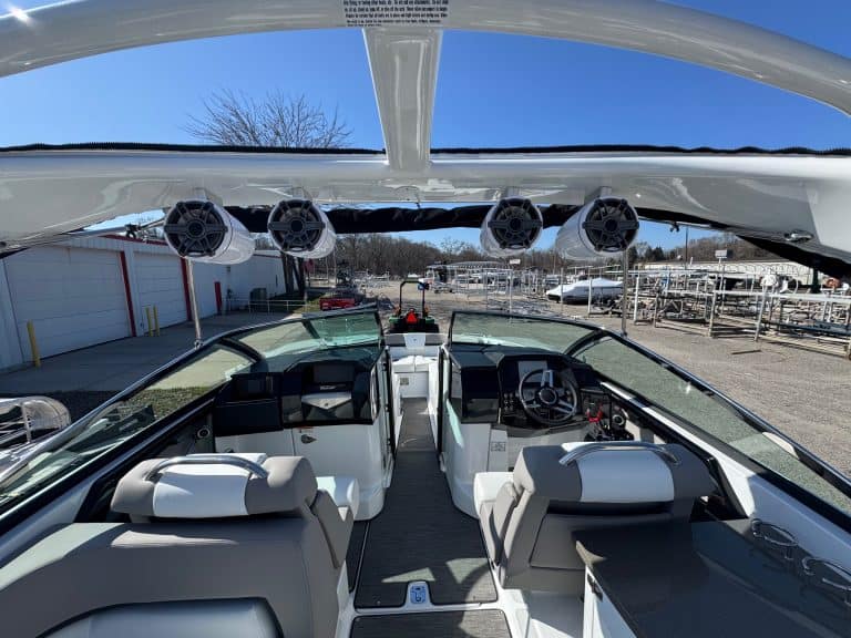 Luxury boat interior with modern controls and seating.