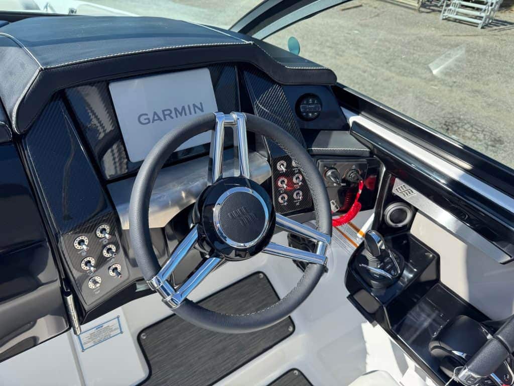 Luxury boat dashboard with Garmin navigation system.