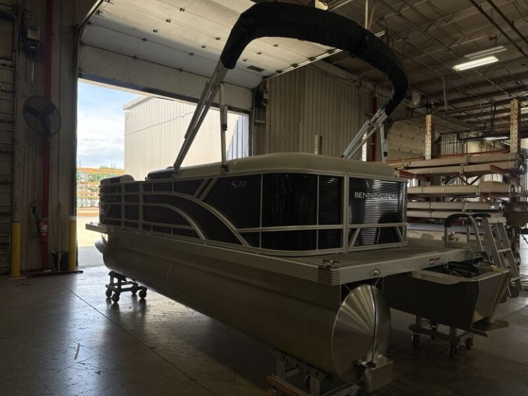 Bennington 20SL S1 pontoon boat inside dealership, ready for sale.