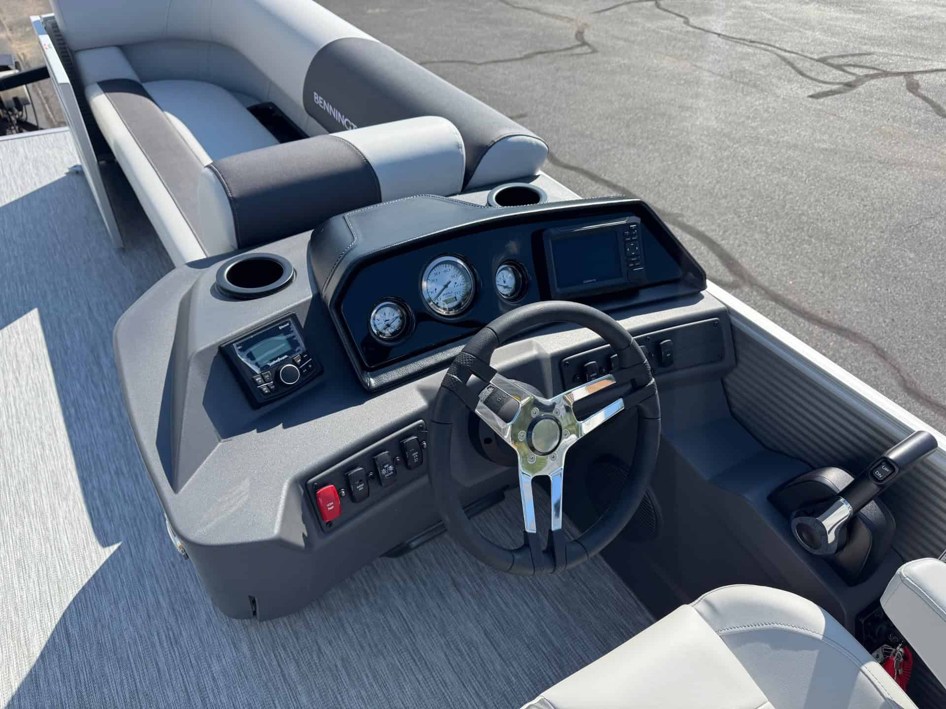 Bennington 20SL S1 boat dashboard with steering wheel and control panel.