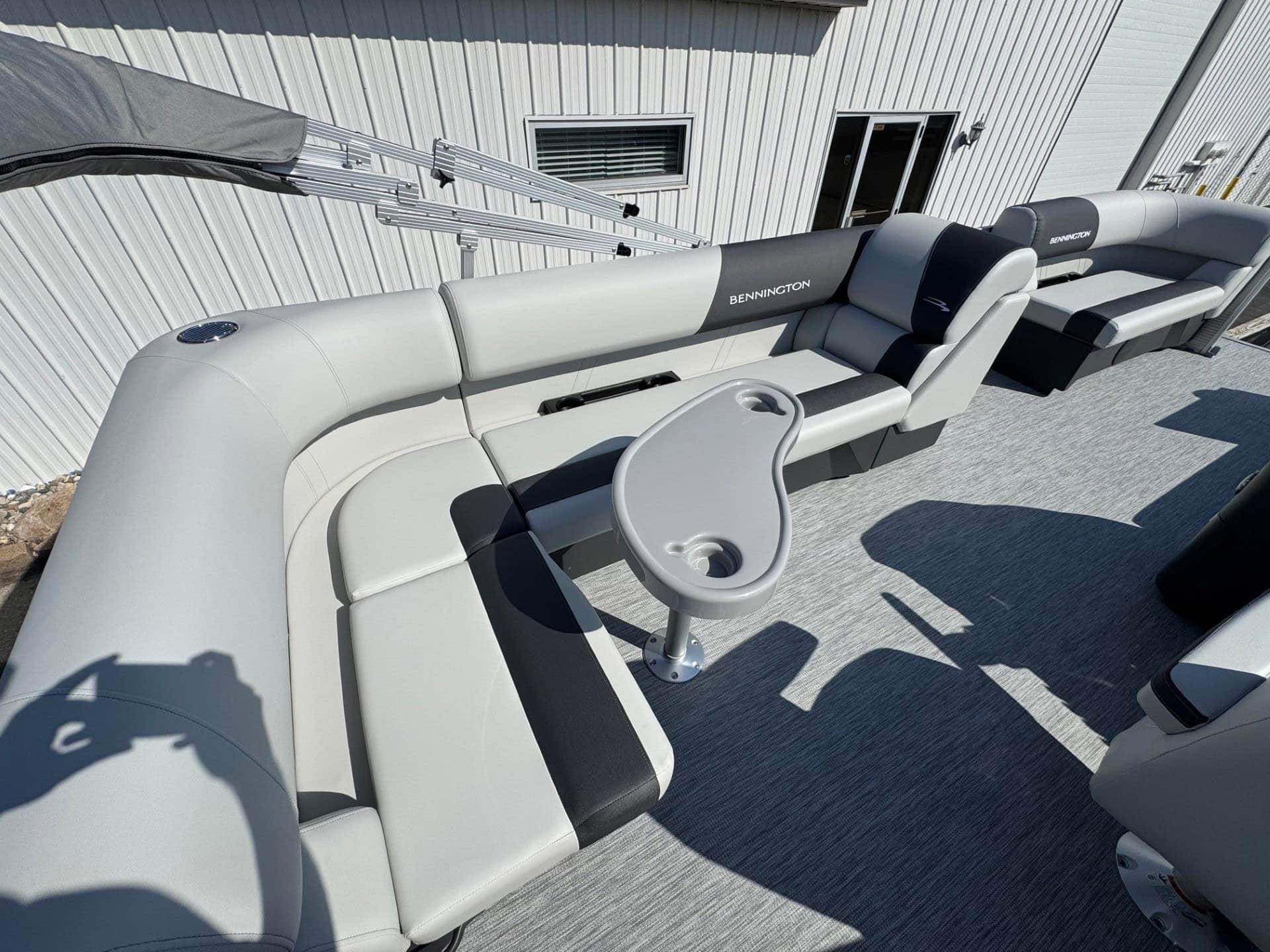 Bennington 20SL S1 pontoon boat with seating and steering console at Hall's Sport Center.