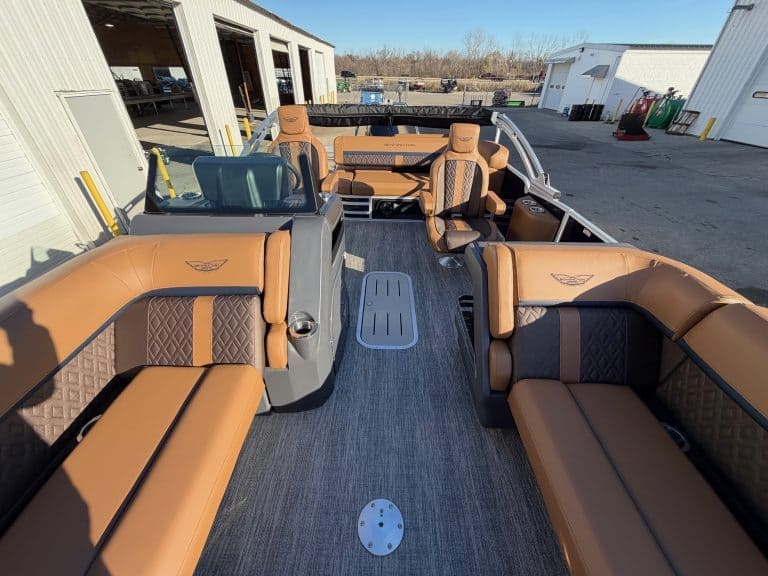 Bennington 22 MSB pontoon boat with spacious seating at Hall's Sport Center. Perfect for family outi.