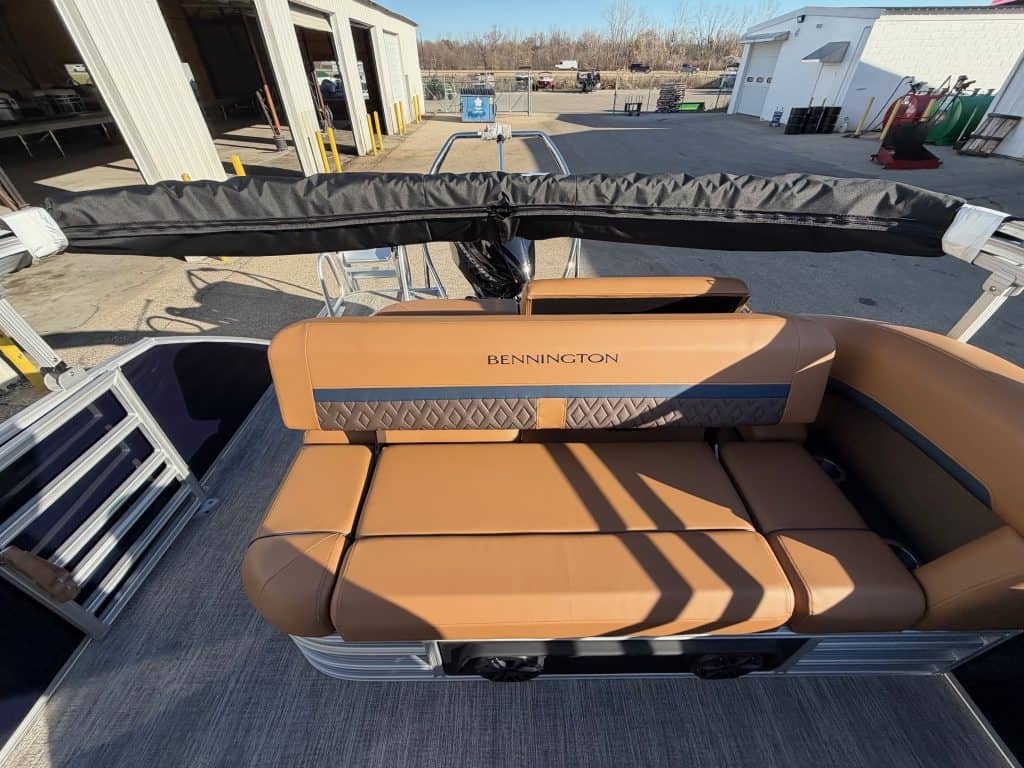 Bennington 22 MSB pontoon boat with tan seating at Hall's Sport Center dealership.
