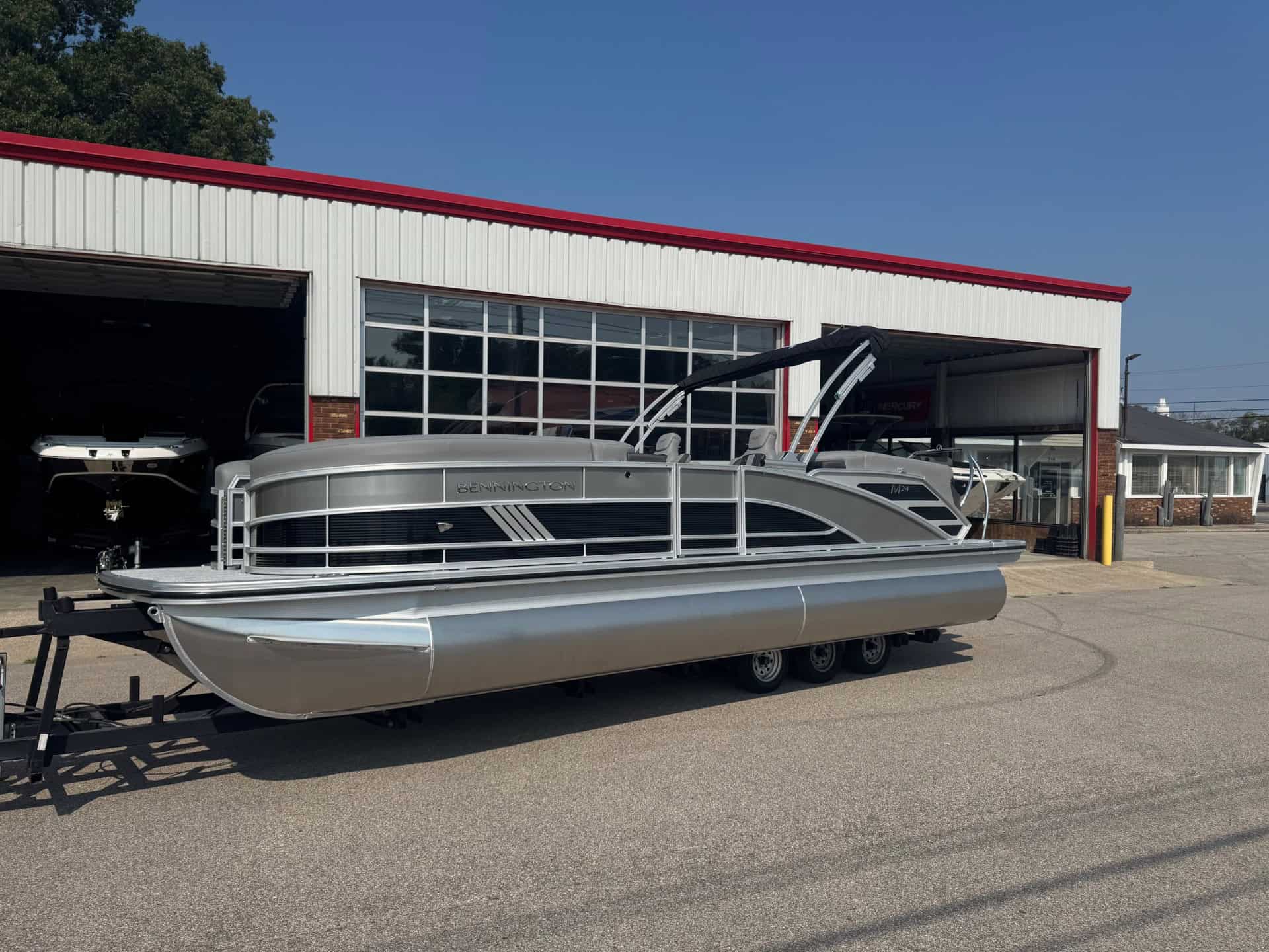 Bennington 24 MFB pontoon boat at Hall's Sport Center dealership.