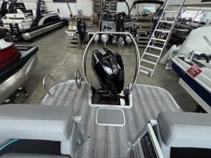 Bennington 24 MFB pontoon boat with outboard motor on display at Hall's Sport Center.