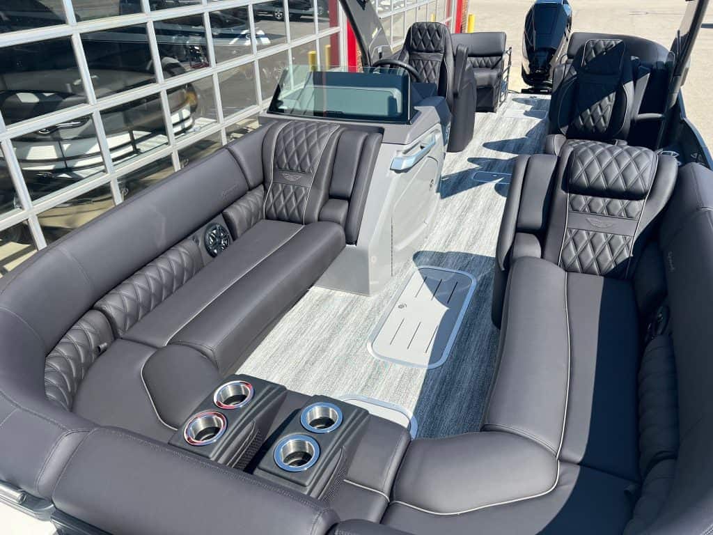 Luxury Bennington 25 QFBA pontoon boat with spacious seating and premium features.