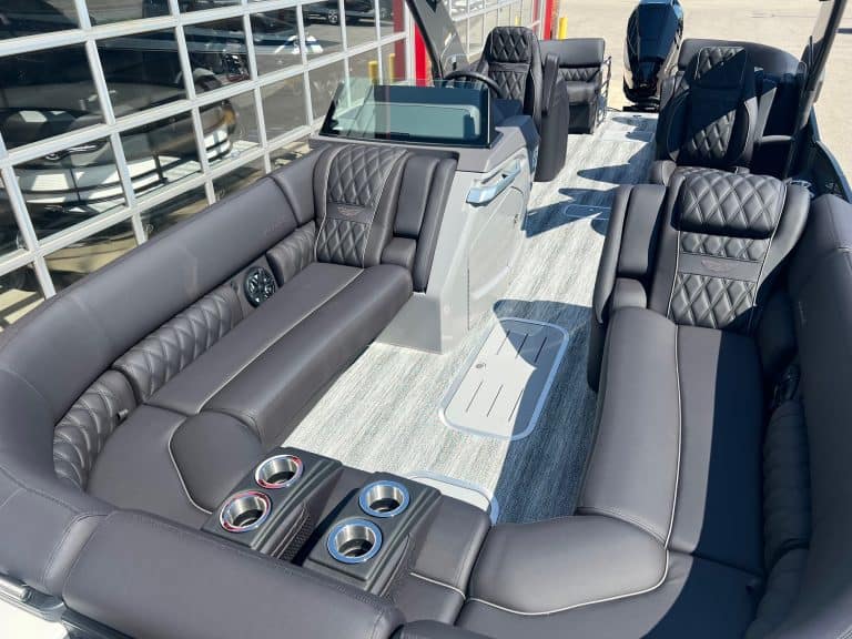Luxury Bennington 25 QFBA pontoon boat with spacious seating and premium features.