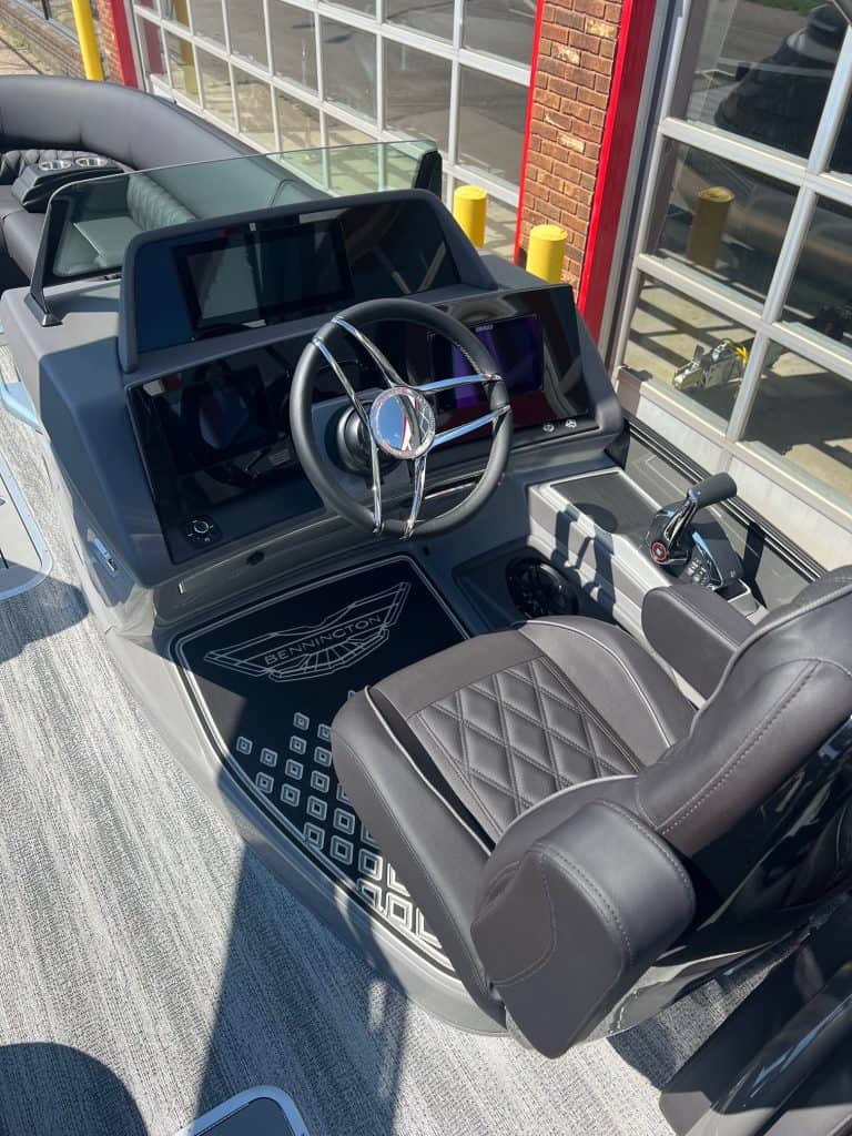 Premium boat helm with digital display and steering wheel at Hall's Sport Center.